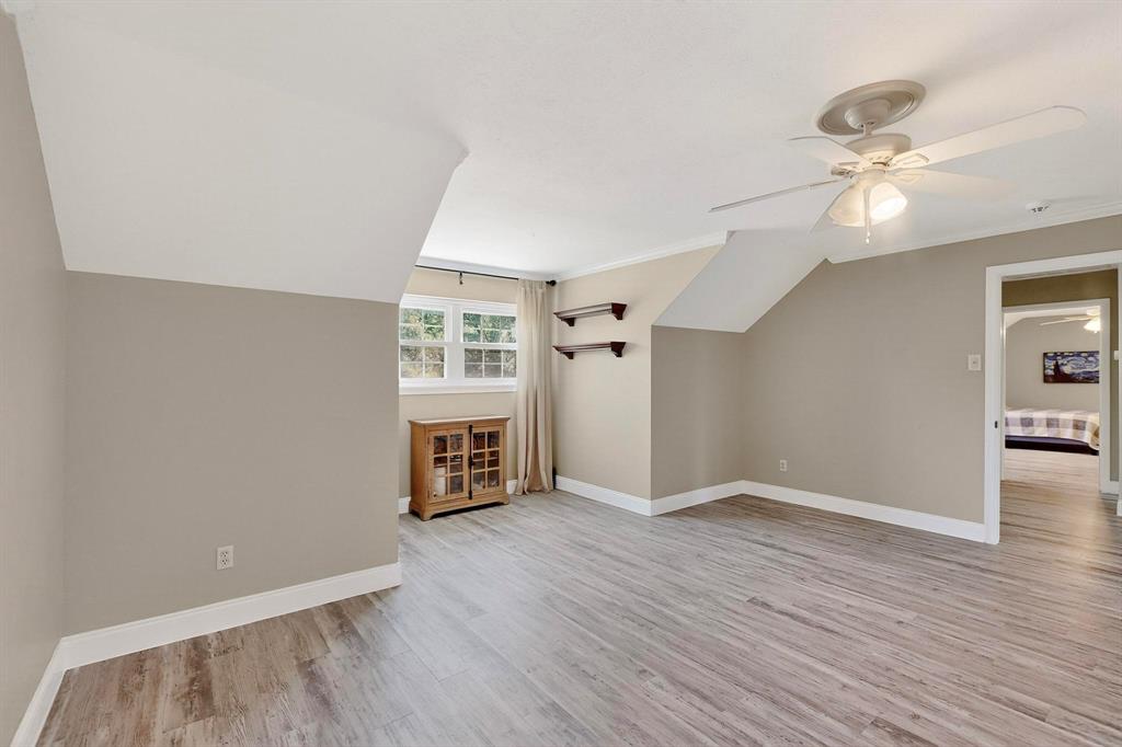 11717 Welch Road Dallas, TX 75229 - Photo 35 of 40 wooden floor in an empty room with a window