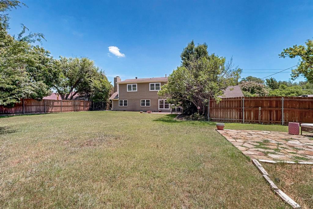 11717 Welch Road Dallas, TX 75229 - Photo 38 of 40 a house with trees in front of it