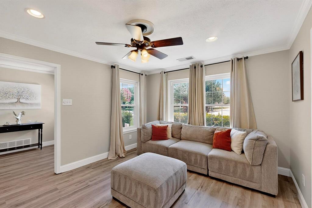 11717 Welch Road Dallas, TX 75229 - Photo 6 of 40 a living room with furniture and a large window