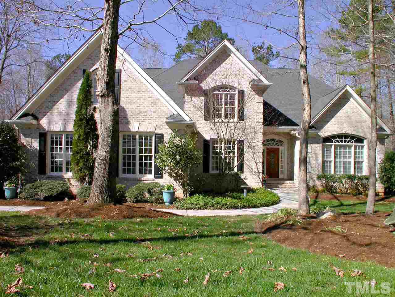 7017 Millstone Ridge Court Raleigh, NC 27614 - Photo 1 of 25 a front view of a house with a yard and potted plants