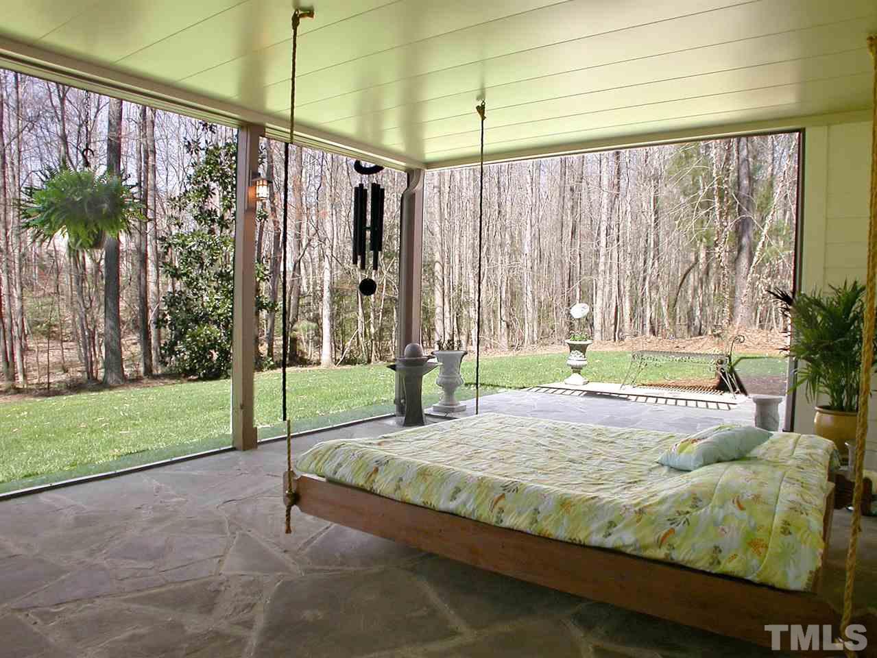 7017 Millstone Ridge Court Raleigh, NC 27614 - Photo 22 of 25 a bed sitting in a room next to a window