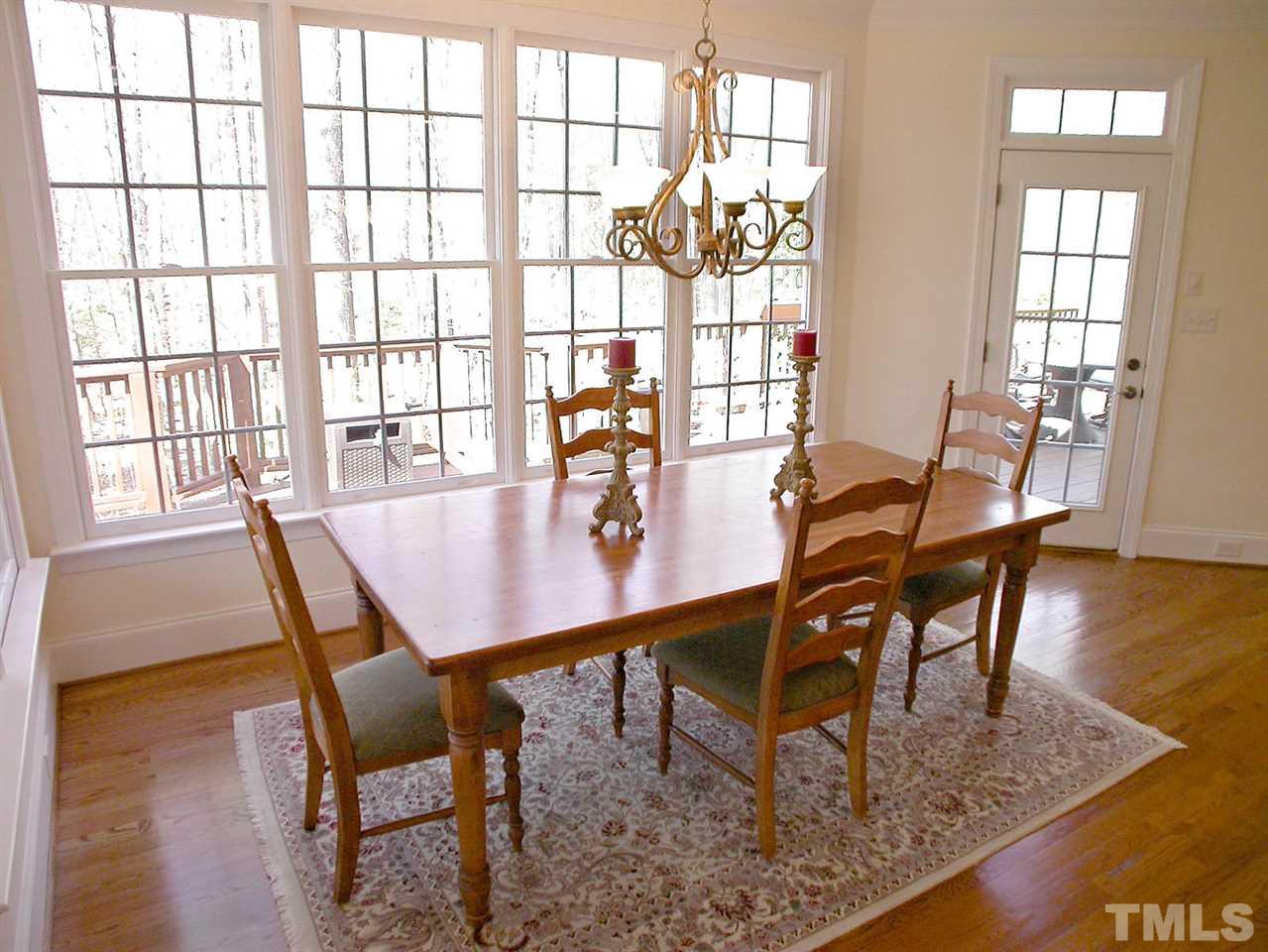 7017 Millstone Ridge Court Raleigh, NC 27614 - Photo 5 of 25 a dining room with furniture and wooden floor