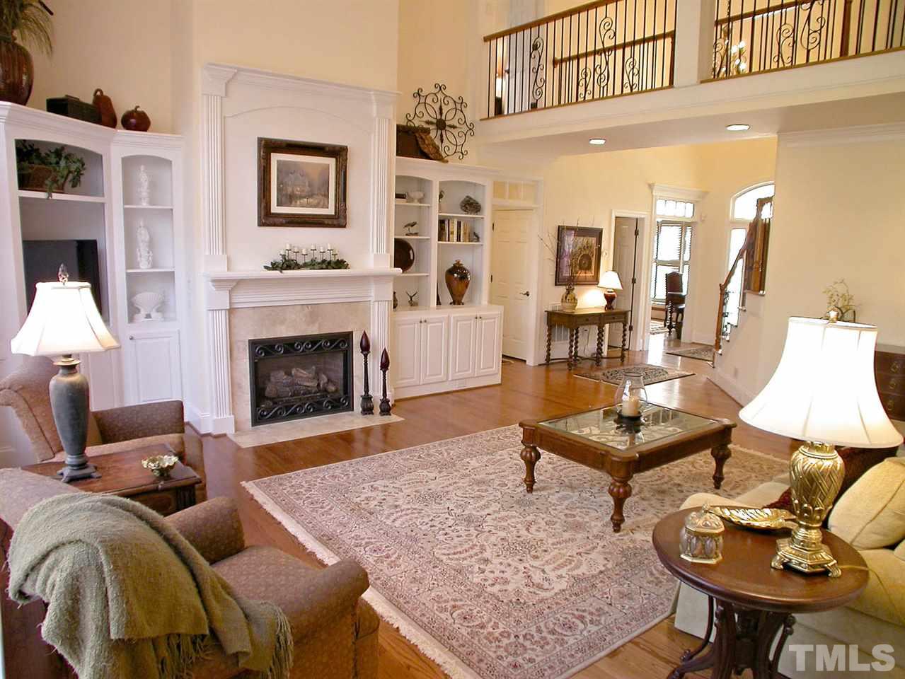 7017 Millstone Ridge Court Raleigh, NC 27614 - Photo 6 of 25 a living room with furniture and a fireplace
