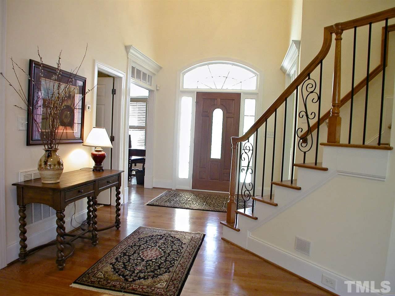 7017 Millstone Ridge Court Raleigh, NC 27614 - Photo 7 of 25 a view of entryway and hall with wooden floor