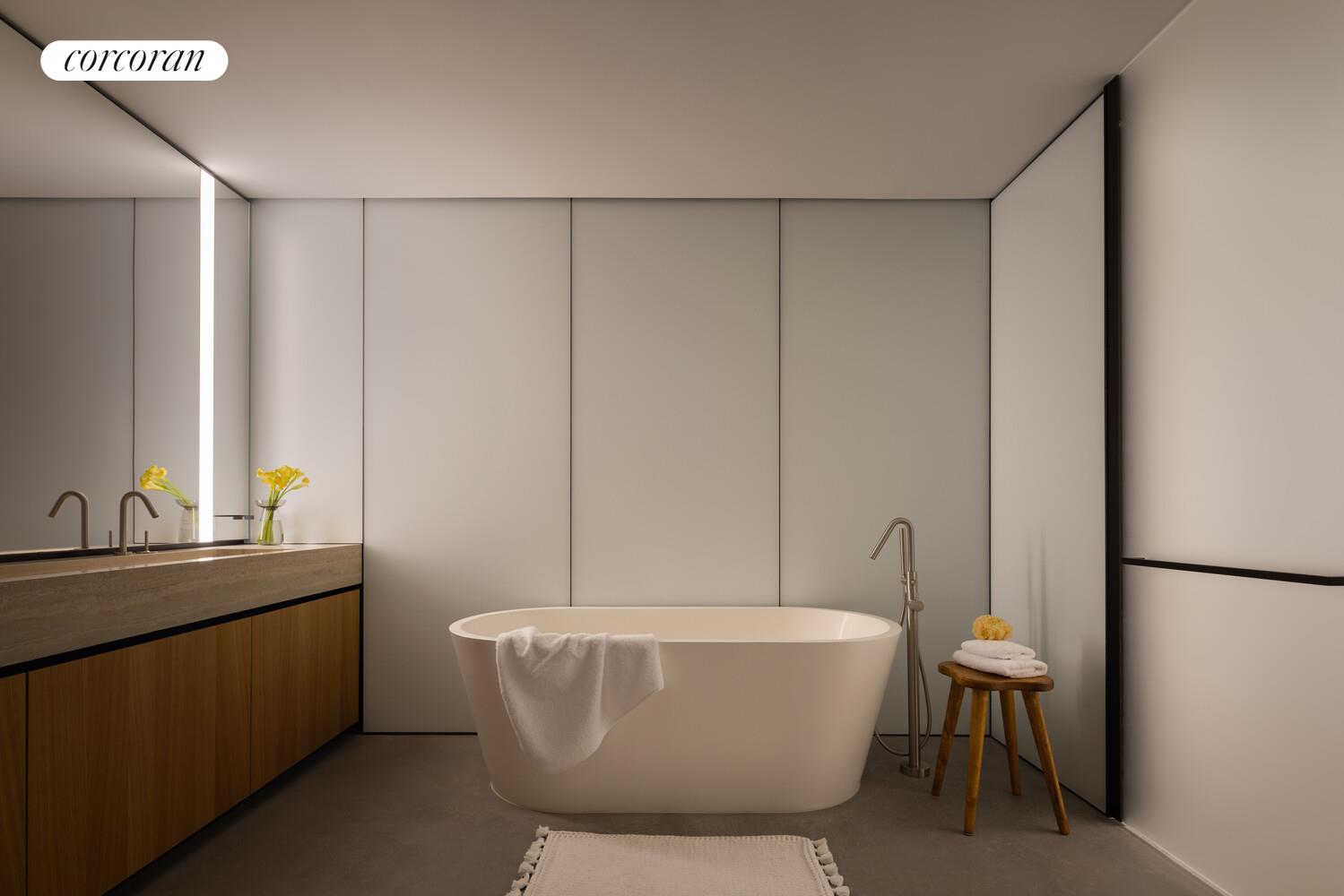 100 East 53rd Street, Unit 5C Manhattan, NY 10022 - Photo 11 of 23 a bathroom with a sink and mirror