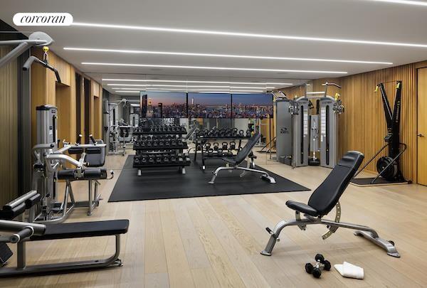 100 East 53rd Street, Unit 5C Manhattan, NY 10022 - Photo 16 of 23 a view of a room with gym equipment
