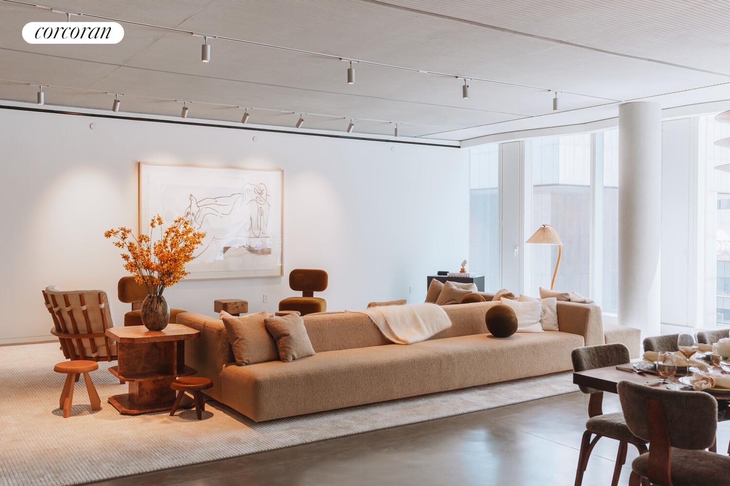 100 East 53rd Street, Unit 5C Manhattan, NY 10022 - Photo 4 of 23 a living room with furniture and a large window