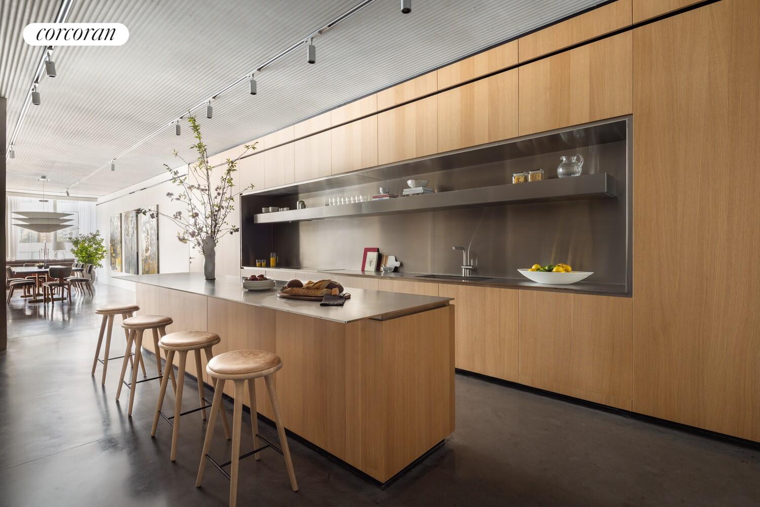 100 East 53rd Street, Unit 5C Manhattan, NY 10022 - Photo 7 of 23 a kitchen with stainless steel appliances granite countertop a sink a stove and a refrigerator