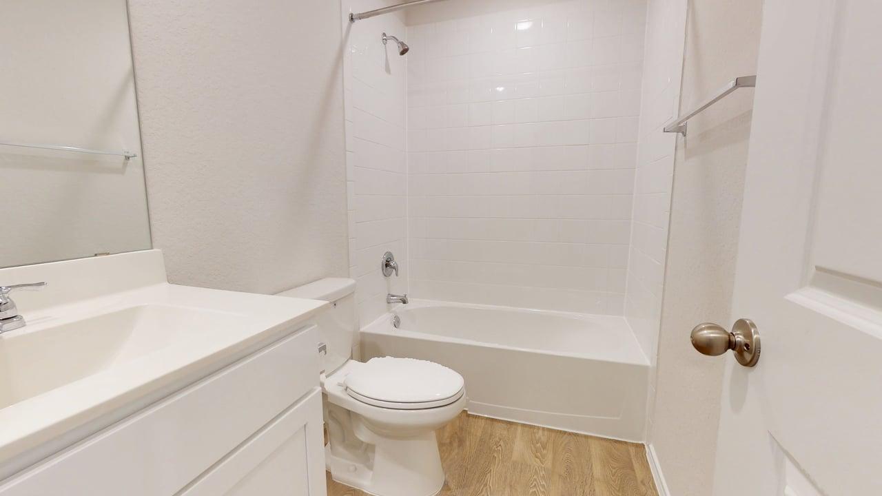 914 Indian Way Seguin, TX 78155 - Photo 13 of 18 a bathroom with a toilet a sink and bathtub