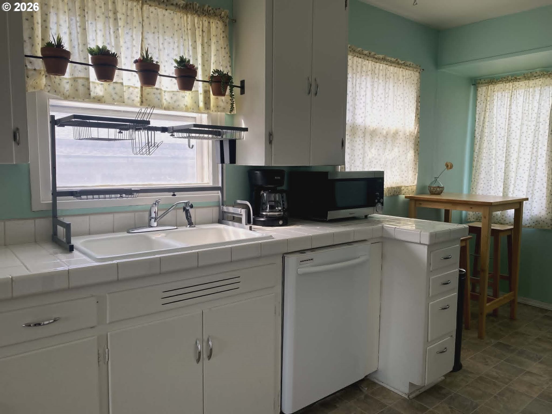 2813 Southwest Ladow Avenue Pendleton, OR 97801 - Photo 4 of 9 a kitchen with stainless steel appliances granite countertop a sink and a white cabinets