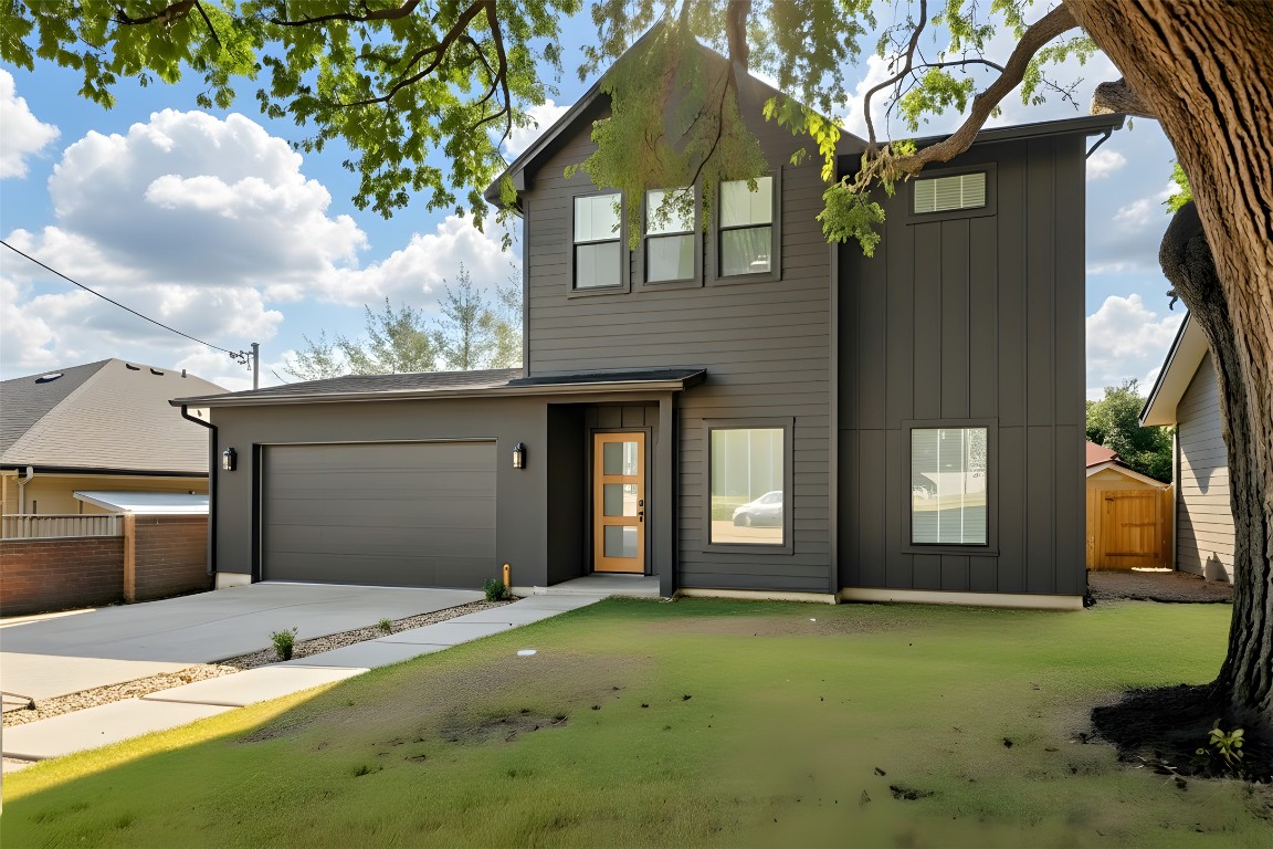 18205 Fair Lane Jonestown, TX 78645 - Photo 1 of 40 a front view of a house with garden