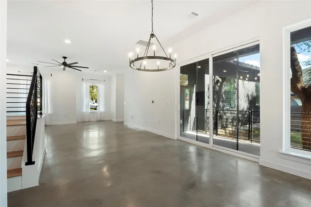 a view of a room with window and wooden floor