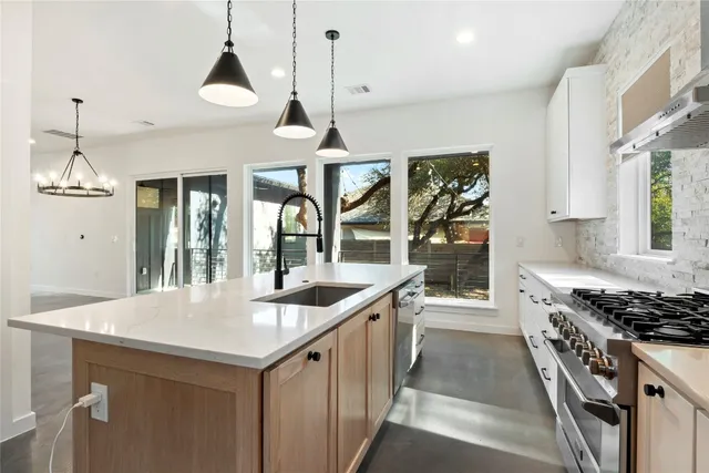 a kitchen with a stove and a sink