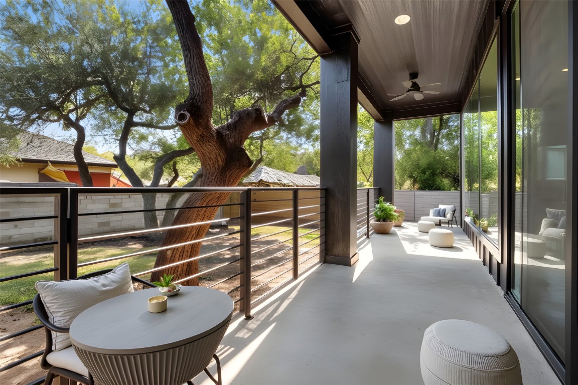 18205 Fair Lane Jonestown, TX 78645 - Photo 17 of 40 a balcony with table and chairs