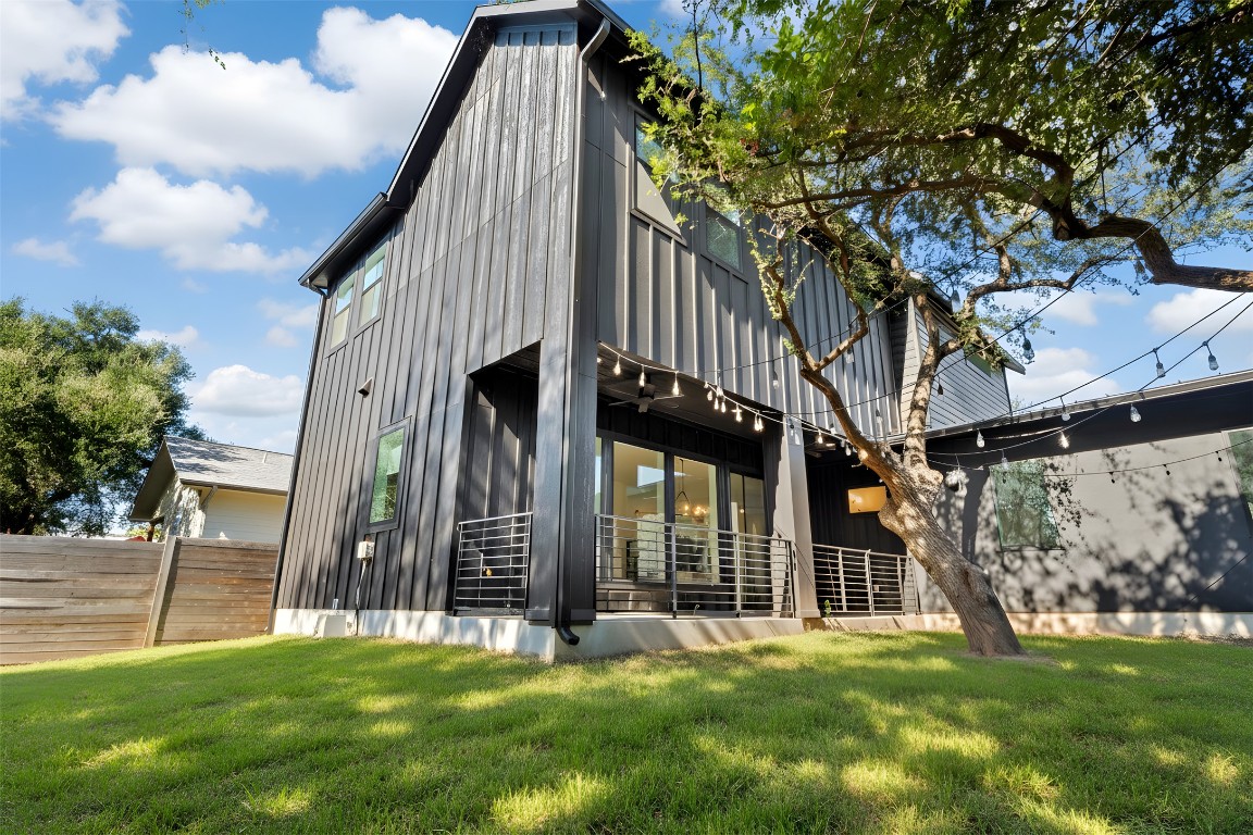 18205 Fair Lane Jonestown, TX 78645 - Photo 19 of 40 a view of a house with backyard and porch
