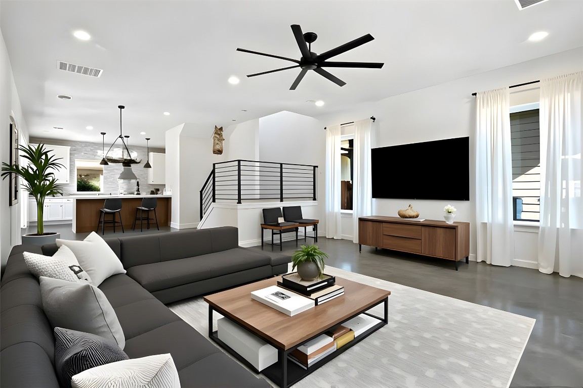 18205 Fair Lane Jonestown, TX 78645 - Photo 5 of 40 a living room with furniture and a flat screen tv