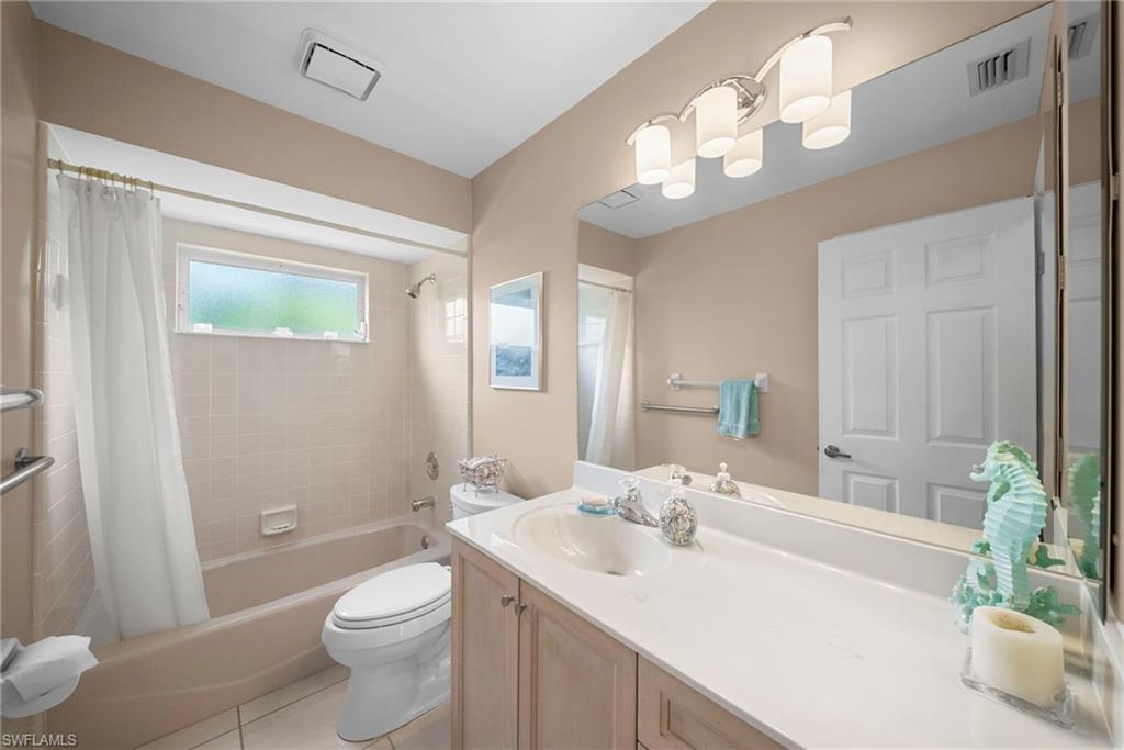 3971 Spring Garden Lane Estero, FL 33928 - Photo 12 of 31 a bathroom with a sink a toilet and shower