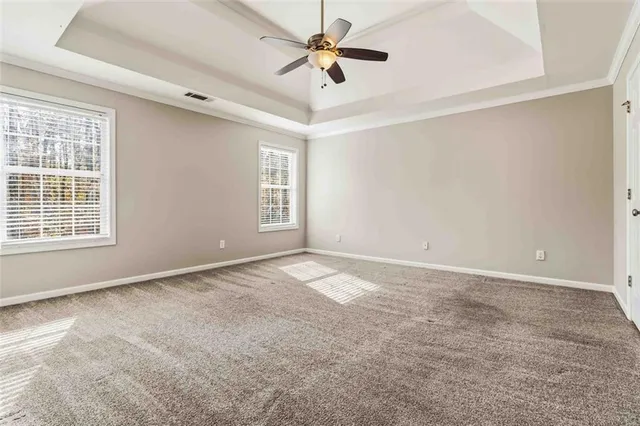a bathroom with a bathtub and a window