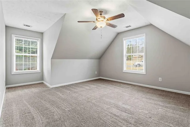 a bathroom with double vanity sink and a mirror