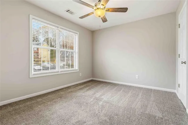 a view of backyard with a deck and wooden floor