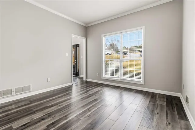 a view of kitchen with stainless steel appliances granite countertop a stove oven and a refrigerator