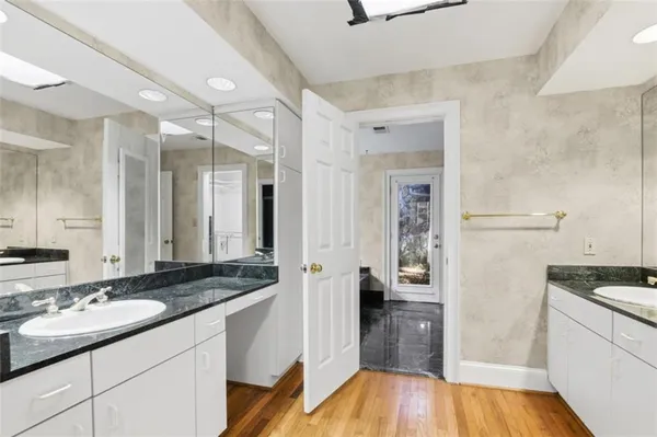 a kitchen with a sink and a refrigerator