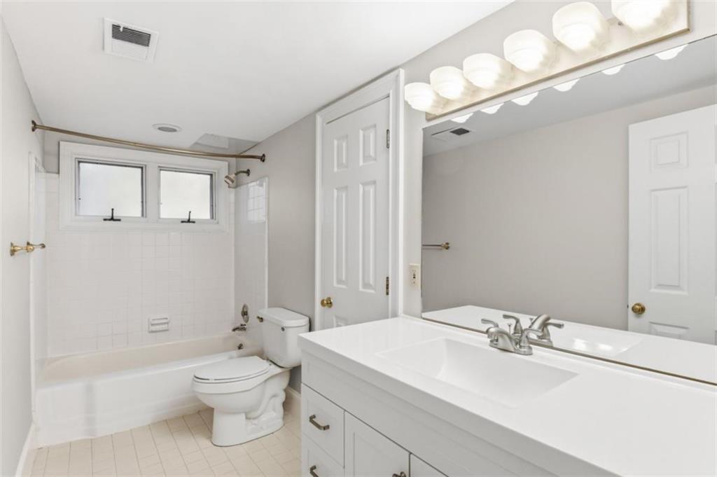 3959 Randall Mill Road Northwest Atlanta, GA 30327 - Photo 24 of 29 a bathroom with a sink a toilet and shower
