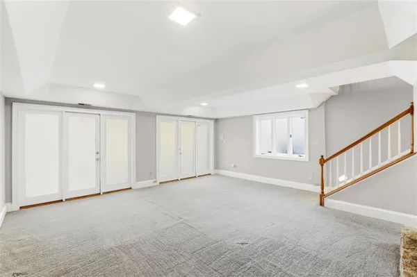 a view of an empty room with stairs