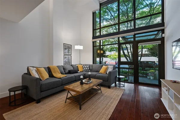 a living room with furniture and a large window