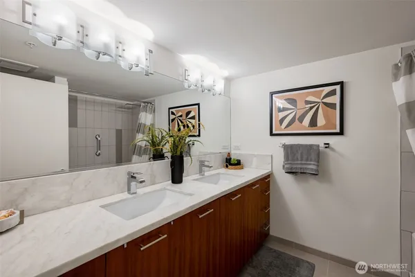 a bathroom with a sink double vanity and a mirror