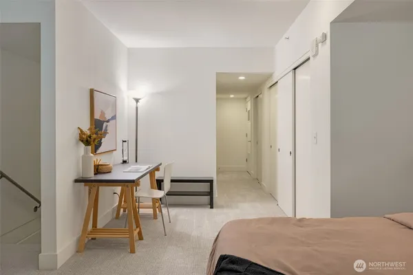 a bedroom with a bed and a table in it
