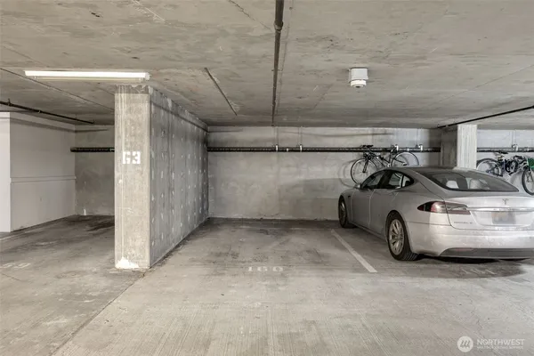 a view of parking garage with cars