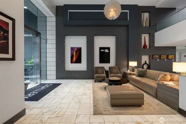 a living room with furniture and a large window