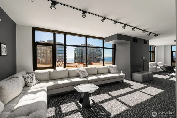 a living room with furniture and a large window