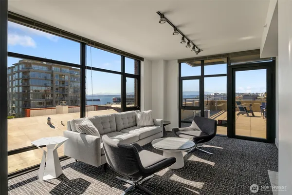 a terrace with outdoor seating and city view