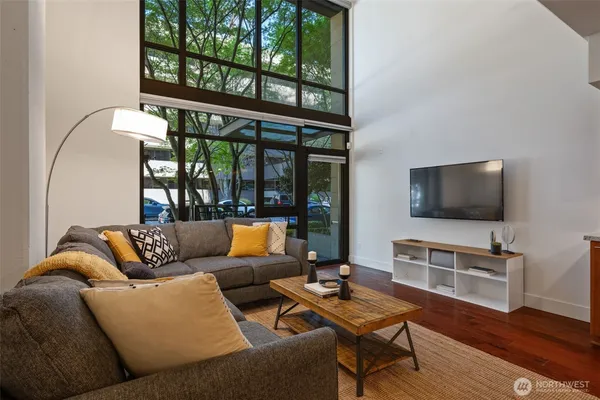 a living room with furniture and a flat screen tv