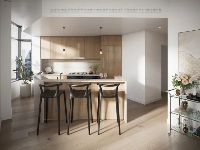 a kitchen with a table chairs stove and cabinets