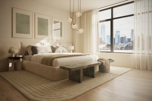 a bedroom with a large bed and a window