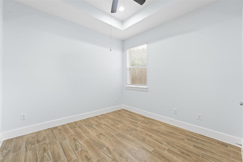 3807 Winding Road Arlington, TX 76016 - Photo 15 of 23 Bright room featuring wood-look tile flooring and crisp white walls