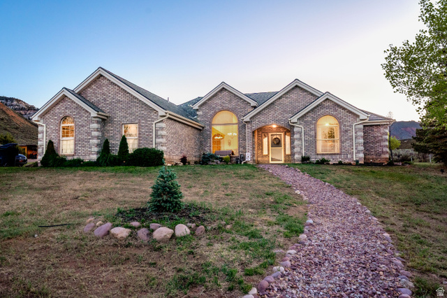 7343 North Sawtooth Cv Road Vernal, UT 84078 - Photo 63 of 64 Brick exterior residence featuring arched windows and gabled rooflines