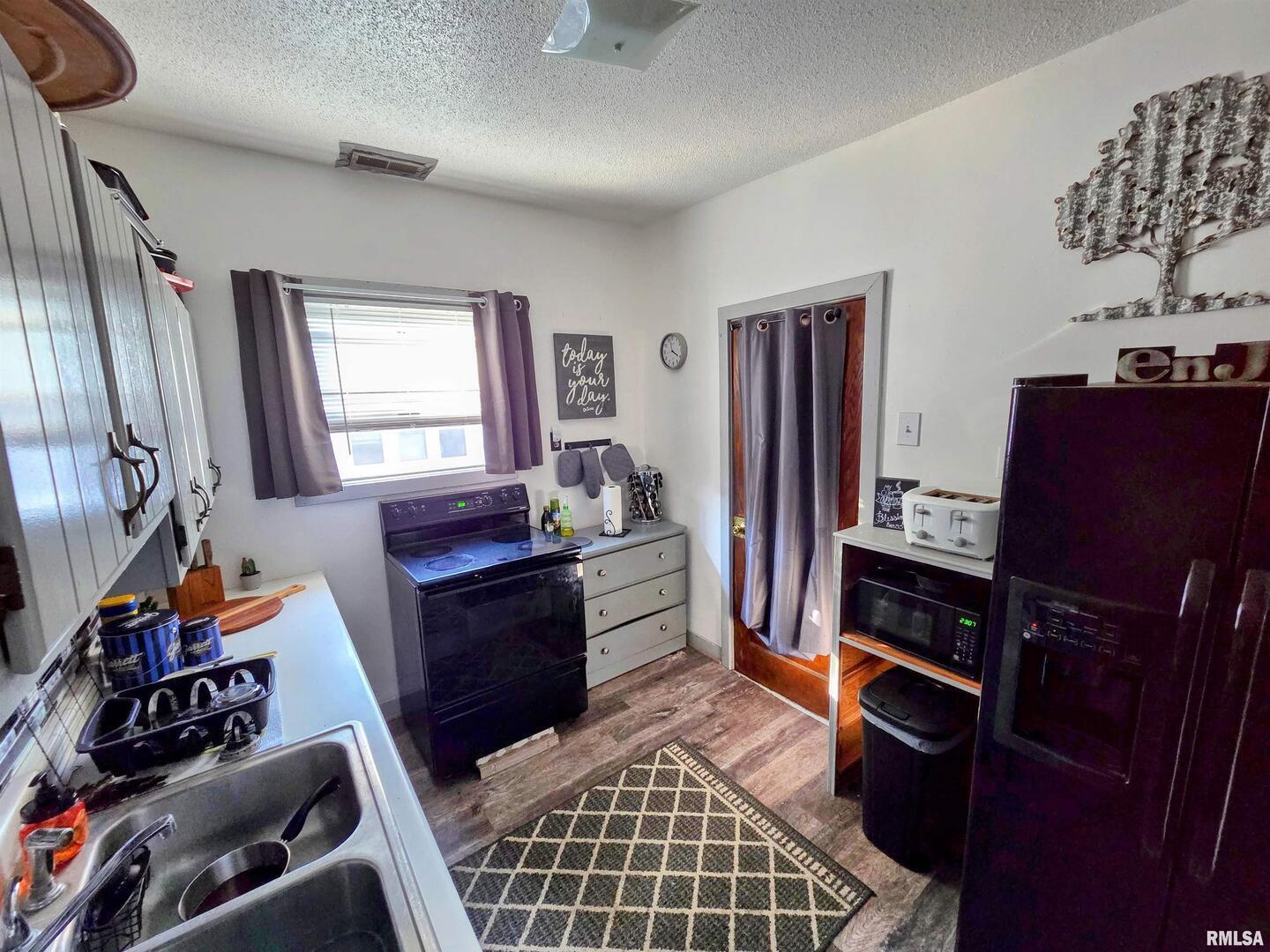 800 6th Avenue South Clinton, IA 52732 - Photo 8 of 12 a room with furniture a window and bookshelf