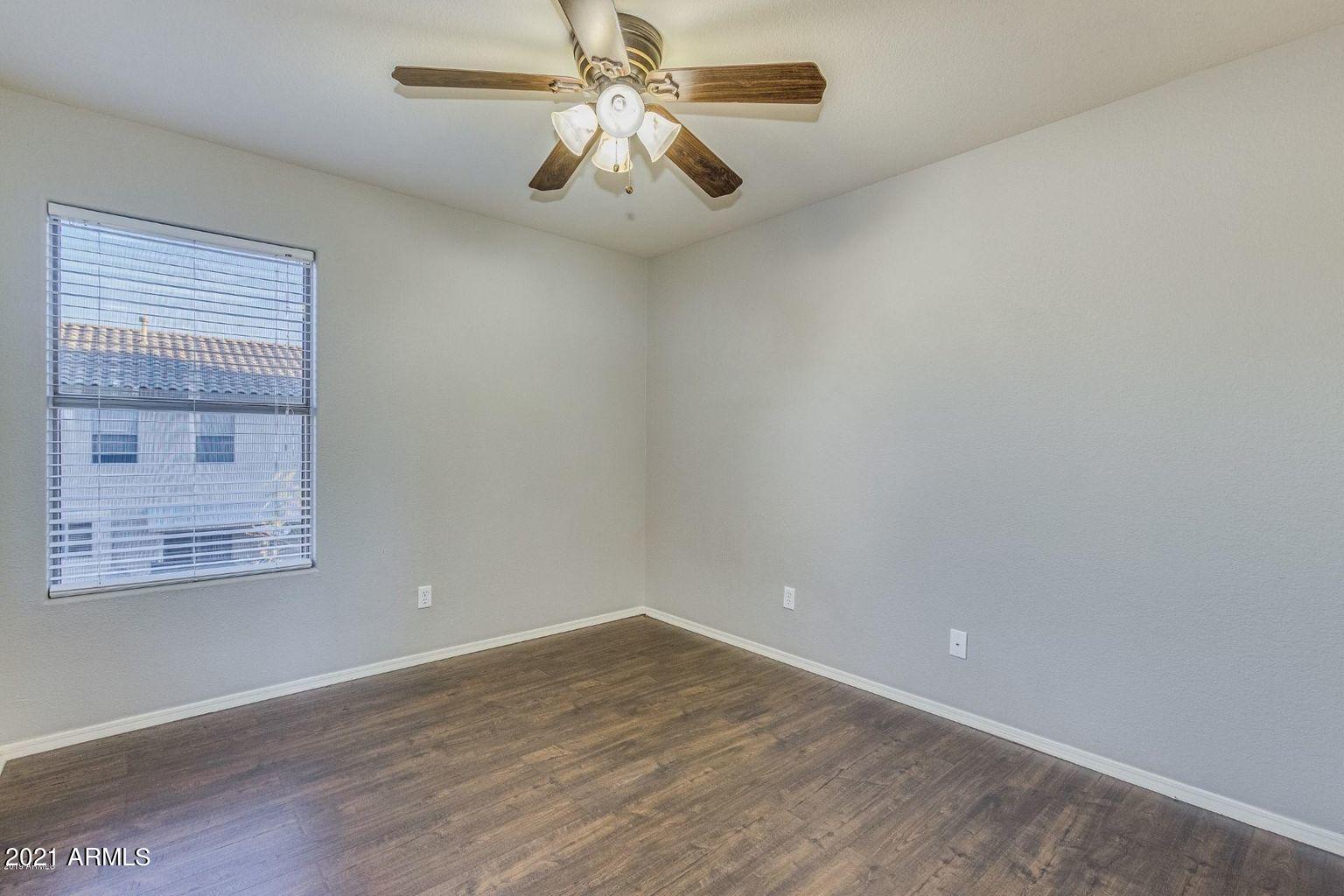 1791 East Del Rio Street Gilbert, AZ 85295 - Photo 17 of 28 an empty room with a window and a fan