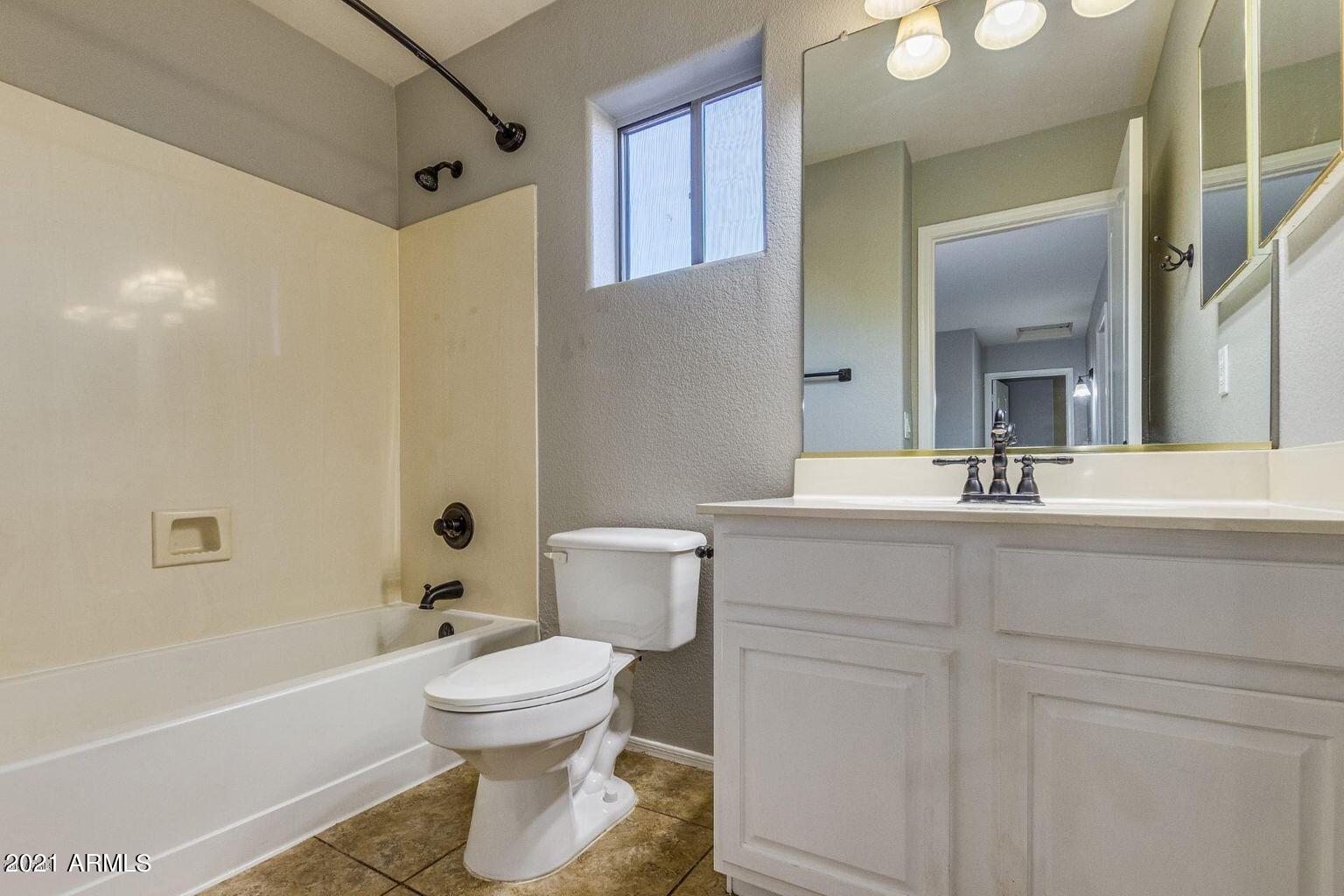 1791 East Del Rio Street Gilbert, AZ 85295 - Photo 19 of 28 a bathroom with a sink a toilet and a bathtub