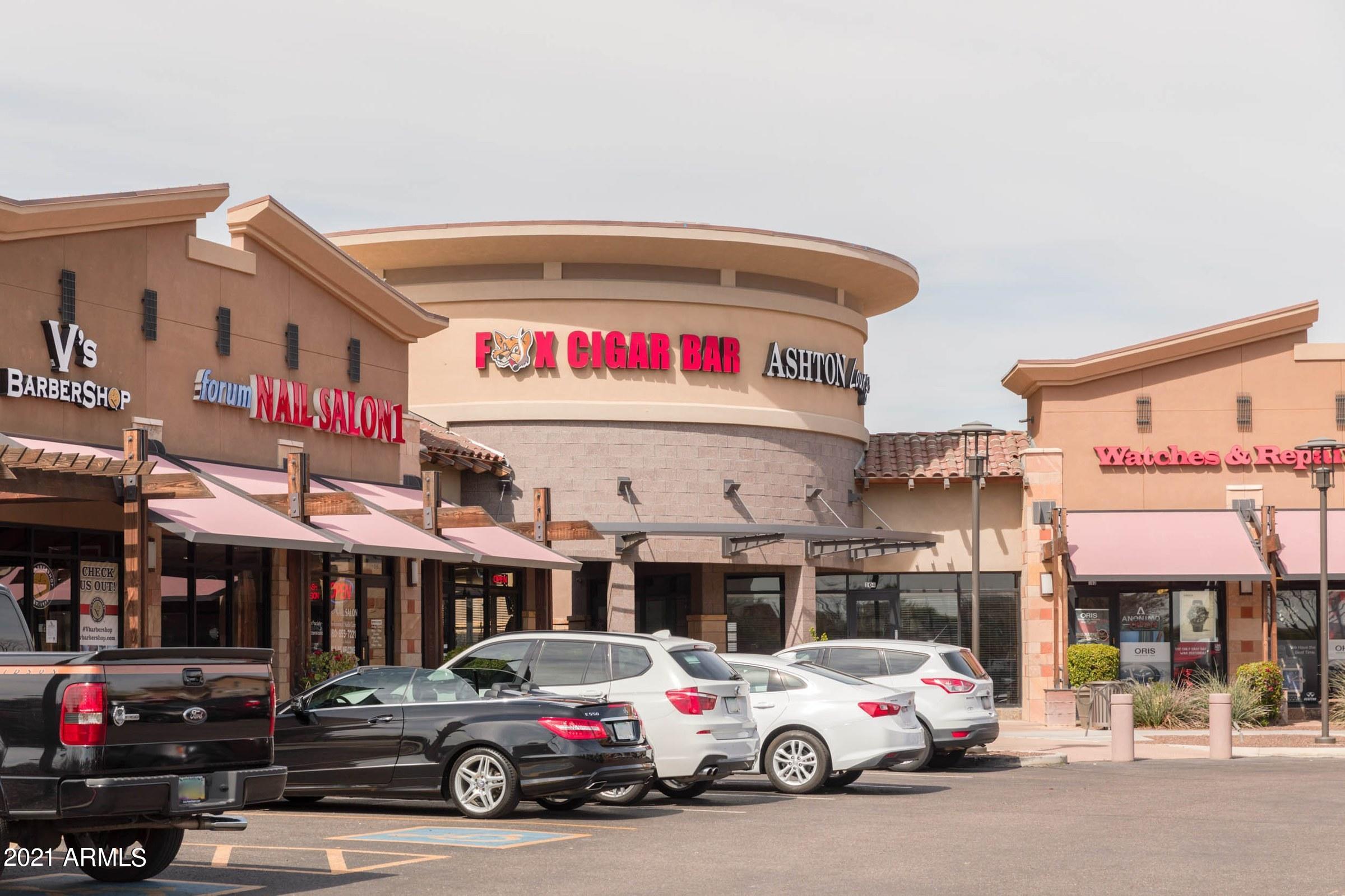 1791 East Del Rio Street Gilbert, AZ 85295 - Photo 22 of 28 a car parked in front of a store