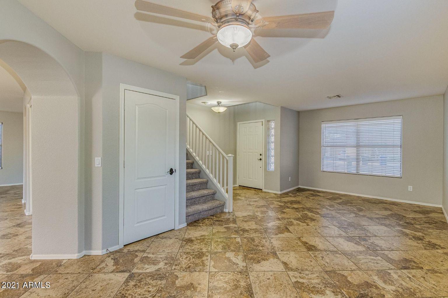 1791 East Del Rio Street Gilbert, AZ 85295 - Photo 3 of 28 a view of an empty room with a ceiling fan