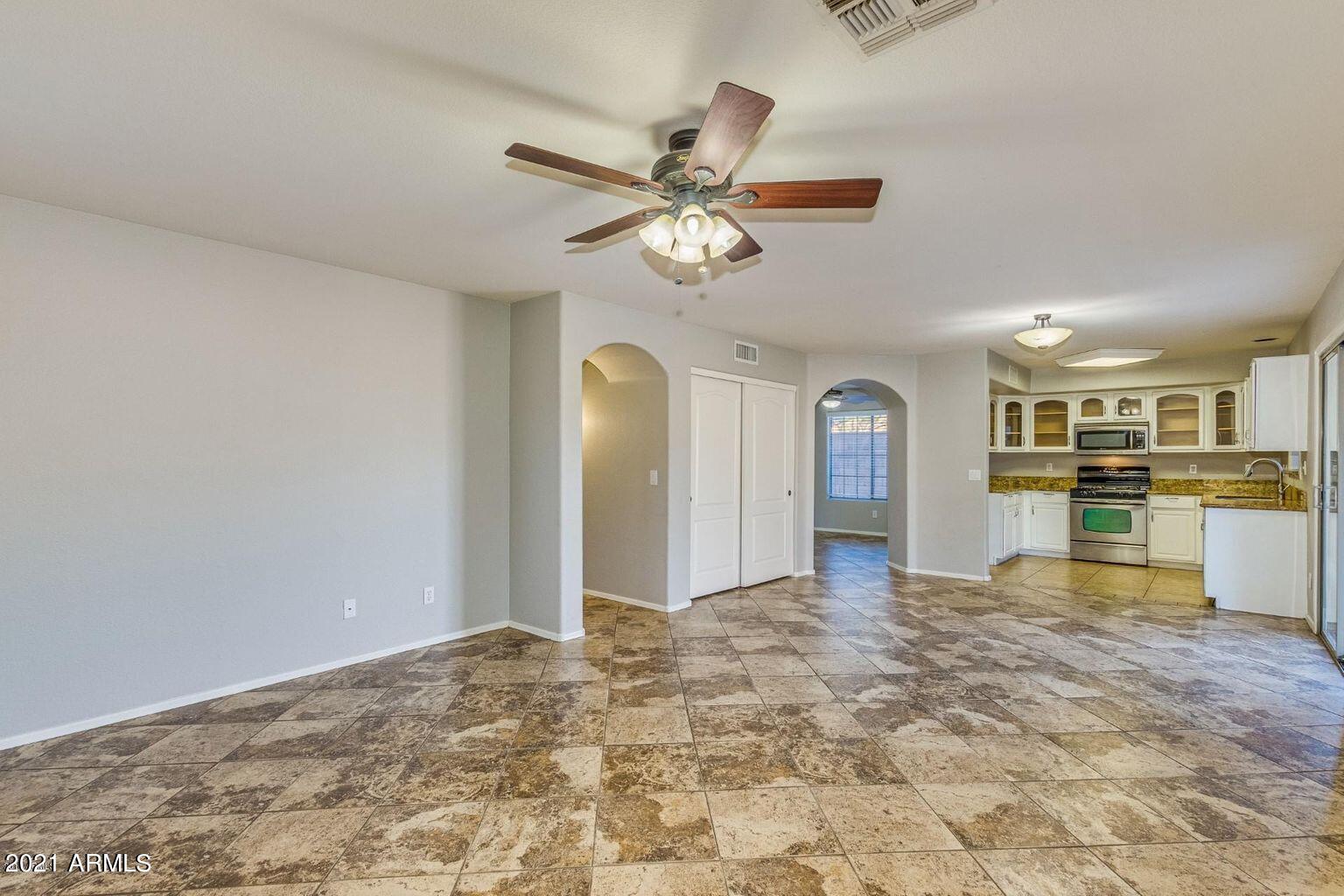 1791 East Del Rio Street Gilbert, AZ 85295 - Photo 4 of 28 a view of an empty room and kitchen view