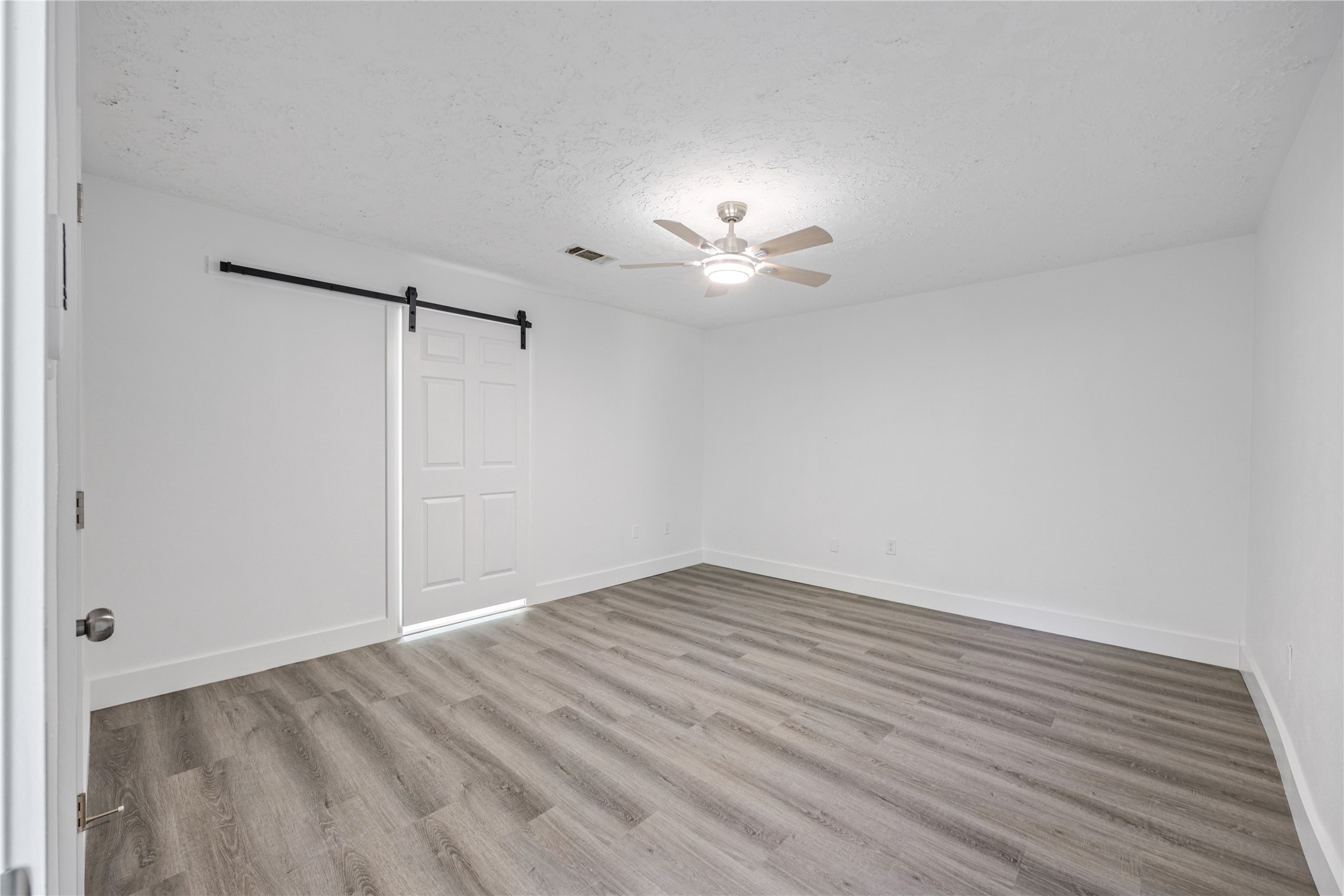 16402 Lobo Lane Spring, TX 77379 - Photo 26 of 35 Large primary bedroom, window was enclosed because of the sunroom addition