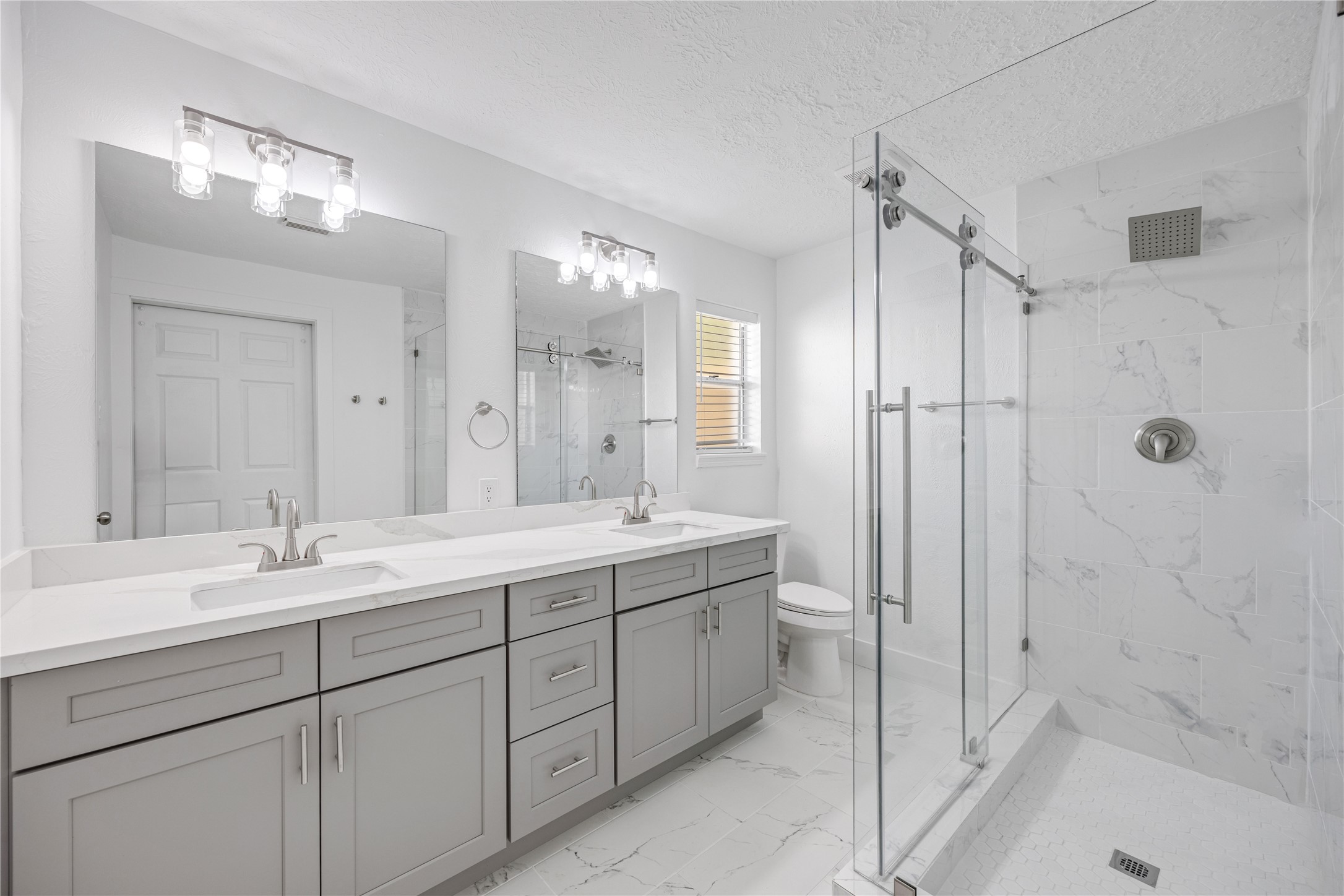16402 Lobo Lane Spring, TX 77379 - Photo 28 of 35 Primary bathroom featuring a dual vanity and huge walk in shower