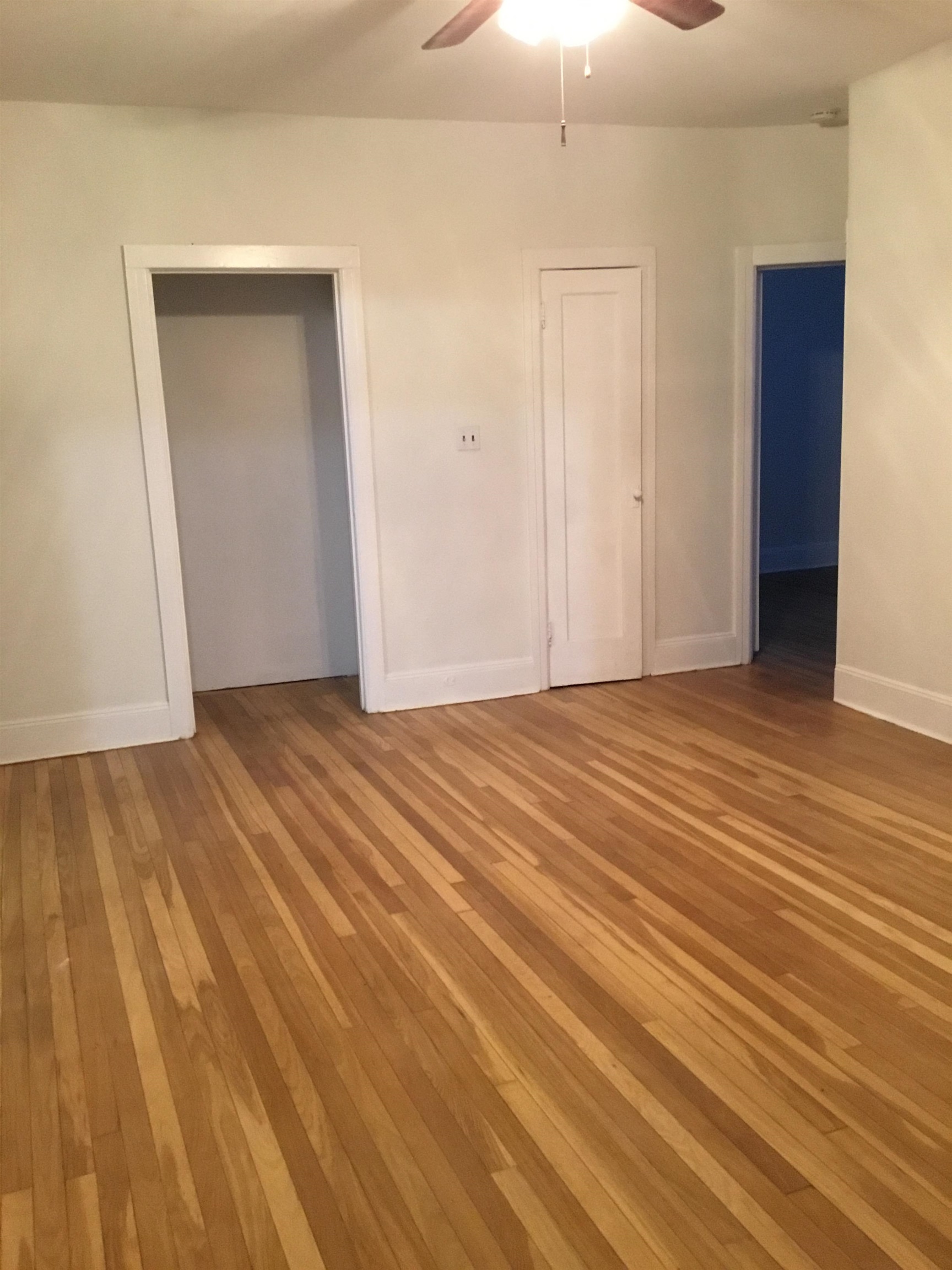 1407 70th Street, Unit 2 North Bergen, NJ 07047 - Photo 12 of 22 a view of an empty room with wooden floor