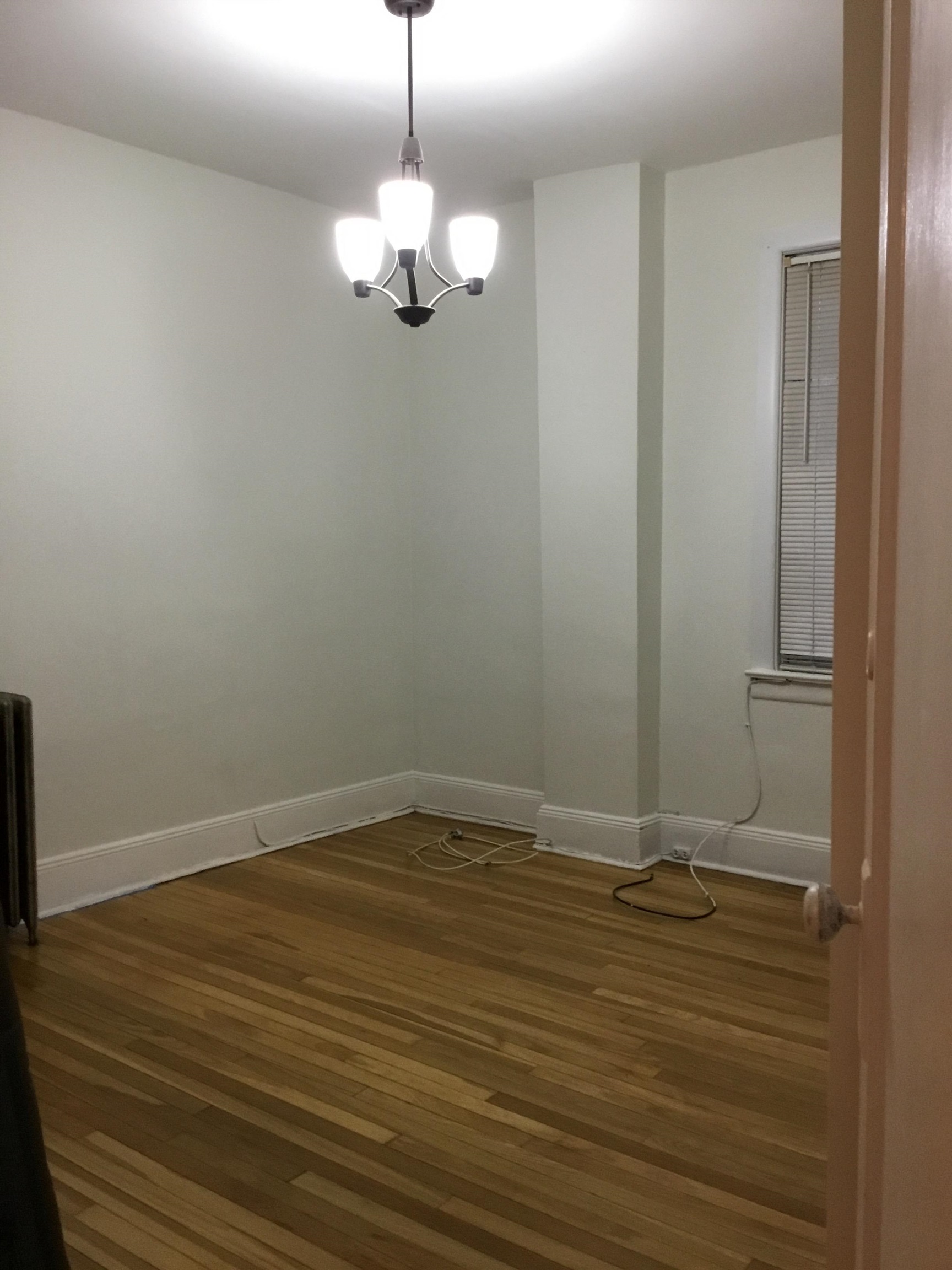 1407 70th Street, Unit 2 North Bergen, NJ 07047 - Photo 16 of 22 a view of an empty room with wooden floor
